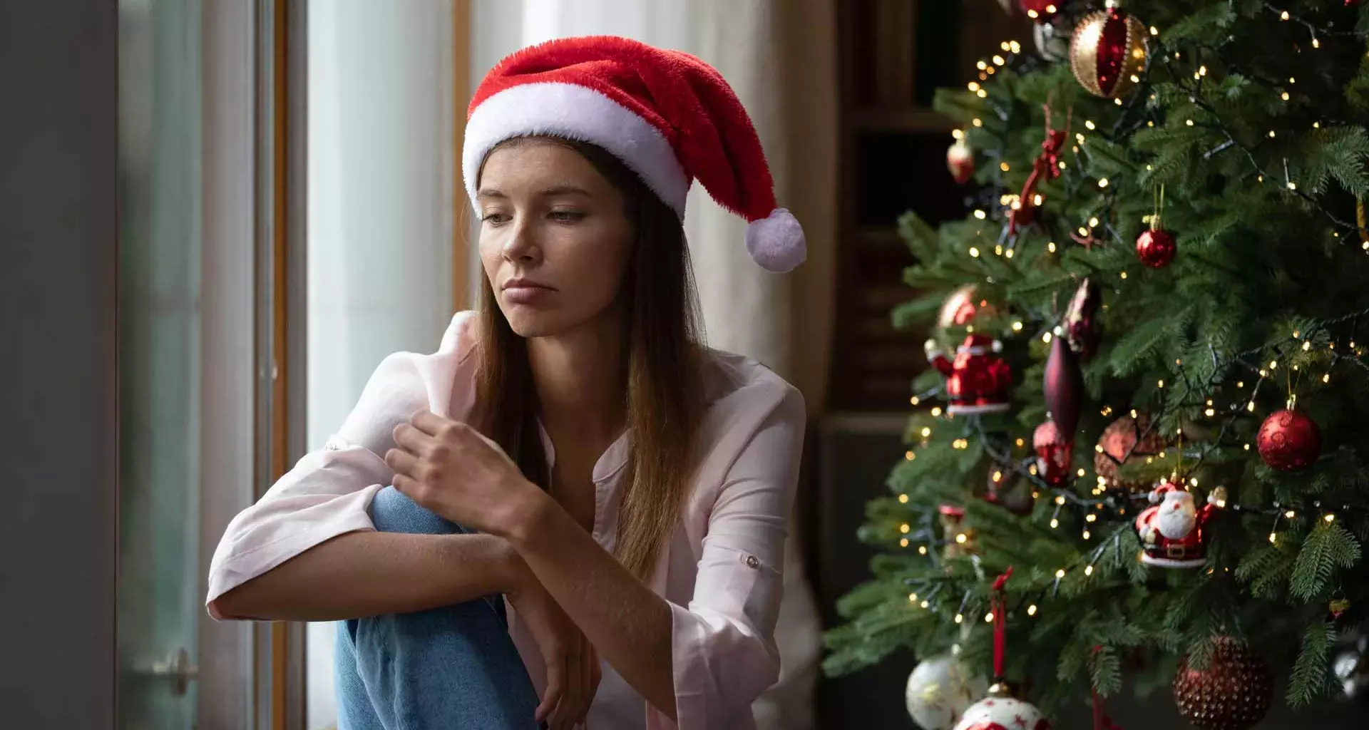 Persona triste y con depresión en Navidad 