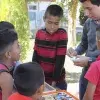 alumnos y niños en la Casa del Migrante